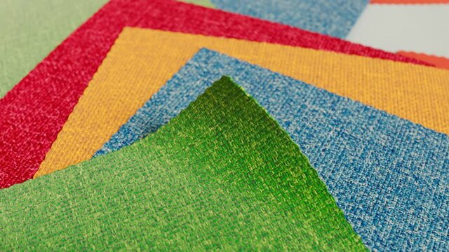 Animation with a set of fabric samples. Square pieces of multiclour materials.