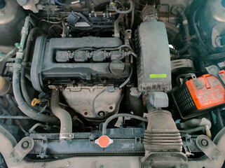 Malaysia, Perak, 29 October 2021: A car with an engine oil leak in the upper part of the engine.
