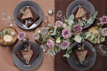 Elegant table setting with beautiful floral decor and burning candles, top view