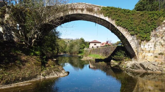 Aerial view of a scenic medieval bridge in Lierganes, Cantabria, Spain. High quality 4k footage