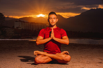 Fototapeta premium Yogi master doing a meditation on the beach