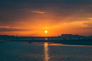 Fototapeta premium Beautiful orange sunset on seaside.Vibrant colors and good summer evening weather. Beaches of Thailand. Koh samui.