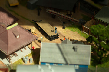 Fototapeta na wymiar Miniature houses. Model of a rural settlement. Toy city. Buildings made of plastic.