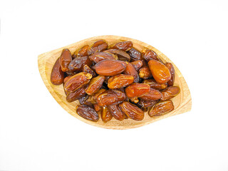 Fresh and healty premium honey tunisia dates (kurma tunisia) in a wooden bowl isolated on white background