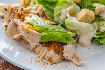 close-up of healthy salad meal with chicken ready to eat