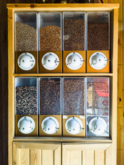 Close up View of Coffee Beans Closet with Various Type and Origins of Coffee Beans on Display for Customers