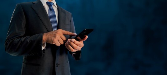 close-up of a businessman using a mobile phone in the future of wireless communication.
