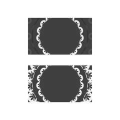 Business card in black with Greek white ornaments for your business.