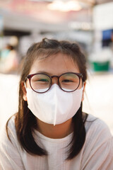 close up asian girl wearing protection face mask