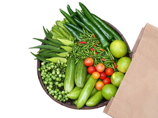 The vegetables set is comprised of variety of organic vegetables and herbs, such as: Winged beans, cucumbers, turkey berry, lemons, tomatoes and chili. Vegetable set in basket.