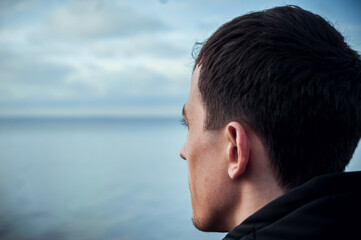 The guy looks at the ocean. Appeasement.