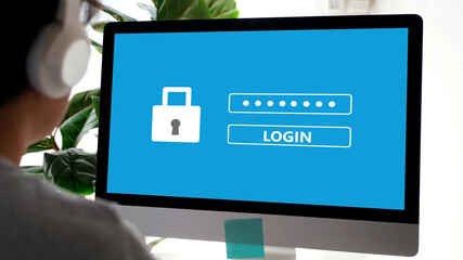 Hand tying computer with password login on screen, cyber security concept