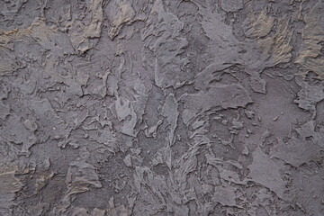 Plastered wall with an unusual pattern. Plaster background.