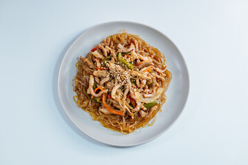 Korean style stir-fried glass noodles pork and vegetables