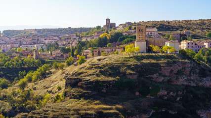 Fototapeta premium Old mountain village above the ravine on a sunny fall day. Sepulveda, Segovia.