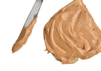 Peanut butter on a slice of bread overhead view