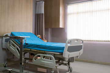 Interior decoration shot of patient room in the hospital bed with medical equipment. Indoor shot no people.