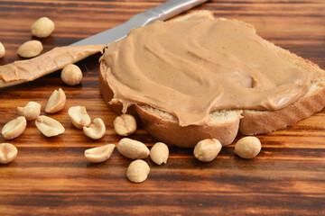 Peanut butter spread on a slice of bread