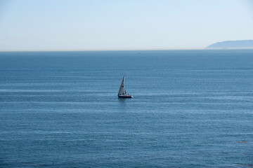Fototapeta premium Sailboat in the ocean on a beautiful summer day