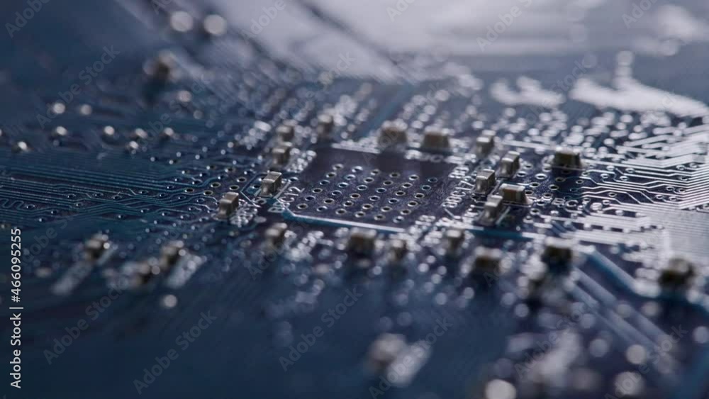 Poster computer electronic circuit board with radial conductor tracks and smd capacitors rotating macro