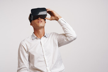 Man virtual reality glasses high-tech simulator technology studio