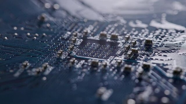 Computer electronic circuit board with radial conductor tracks and SMD capacitors rotating macro