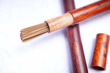 Buddhist incense sticks closeup wooden packaging