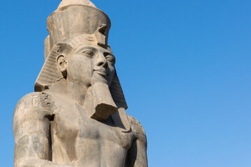 Statue of Ramesses II at Luxor temple with copy space - obrazy, fototapety, plakaty
