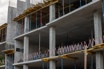 Multi-level commercial high-rise building construction with blue sky © Oleh Marchak