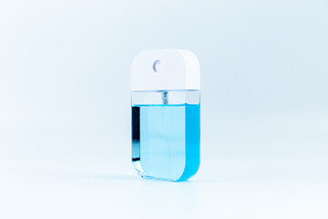 blue alcohol spray on white background.