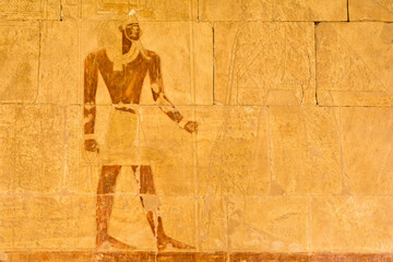 Ancient Egyptian relief painting on temple stone wall