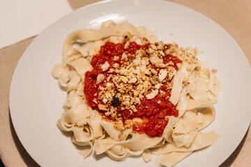 Close-up of dish of homemade pasta with tomato sauce