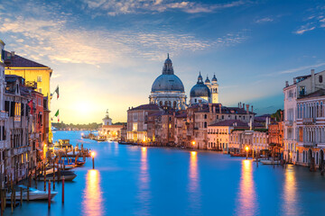 Fototapeta na wymiar View of the Santa Maria della Salute dome in the Grand Canal at sunrise, Venice, Italy