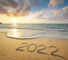 2022 year on the sea shore during sunset