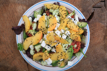 fresh salad with fruits and cheese