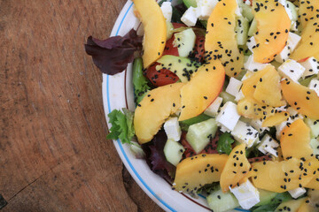 fresh salad with fruits and cheese