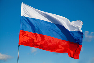 Tricolor flag of Russia waving in the wind close