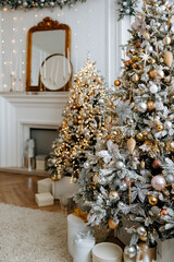 Beautiful Christmas tree with festive gold, white decor against blurred lights on background. Christmas and New Year concept. 