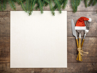 Christmas table place setting with decorations and mockup christmas menu. Christmas menu card. Christmas table place setting
