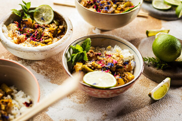 Delicious traditional asian curry in bowls.