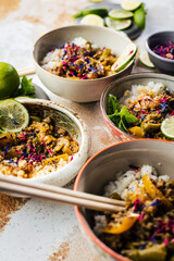 Delicious traditional asian curry in bowls.