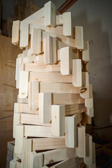 Pine wooden bar structure materials stacked at carpentry woodwork workshop. Close-up. Handcraft hobby