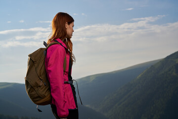 woman hiker outdoors in the mountains landscape fresh air
