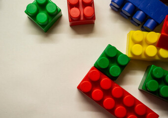 a multi-colored children's designer is lying on a white light table