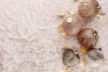Fototapeta na wymiar Golden christmas balls with wool background.