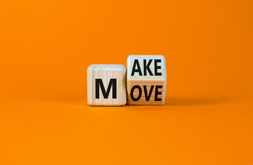 Make your move symbol. Turned a wooden cube with words 'Make move'. Beautiful orange background. Make your move and business concept. Copy space.