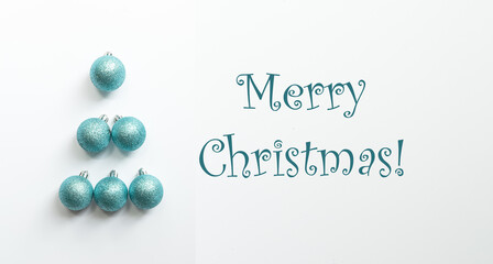 Christmas tree made out of blue balls over light grey background, Christmas and new year background, copy space, seasonal greetings postcard. 