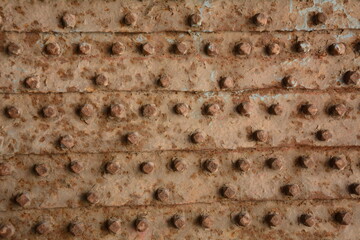 Part of old metal gates with cast patterns detail. Texture of the old gate with metal rivets. Akko(Acre) Israel