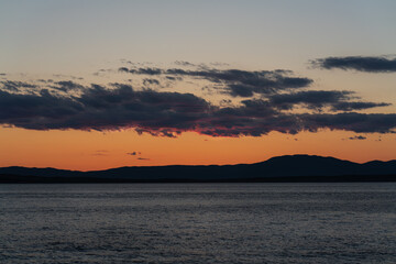 Afterglow over the mountains of the Croatian coast. A summer scene.