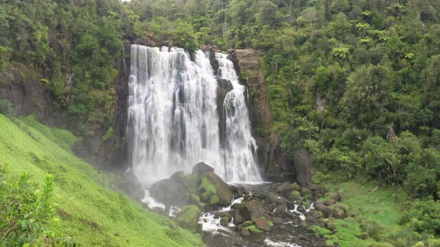 Aerial: Marokopa Falls, a Waterfall in native forest, Waitomo, New Zealand